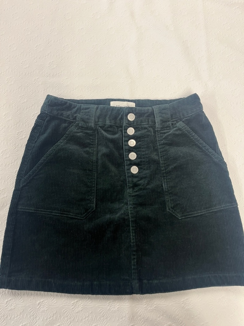 High-Rise Corduroy Button-Front Mini Skirt in Dark Green.